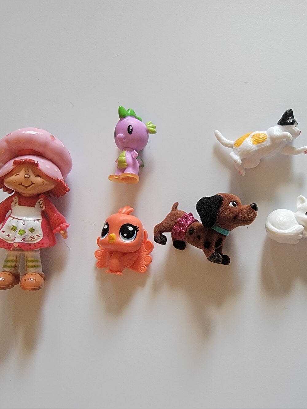Mini Figurine Lot — Strawberry Doll, Barbie Pets, Peacock, Sleeping Cat, Axolotl